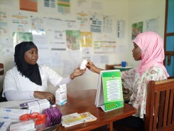 Nordina Amade receives counseling from Nurse Ana Caice