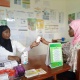 Nordina Amade receives counseling from Nurse Ana Caice